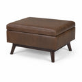 Puf rectangular de cuero sintético con patas de madera