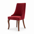 Silla de terciopelo rojo con patas de madera